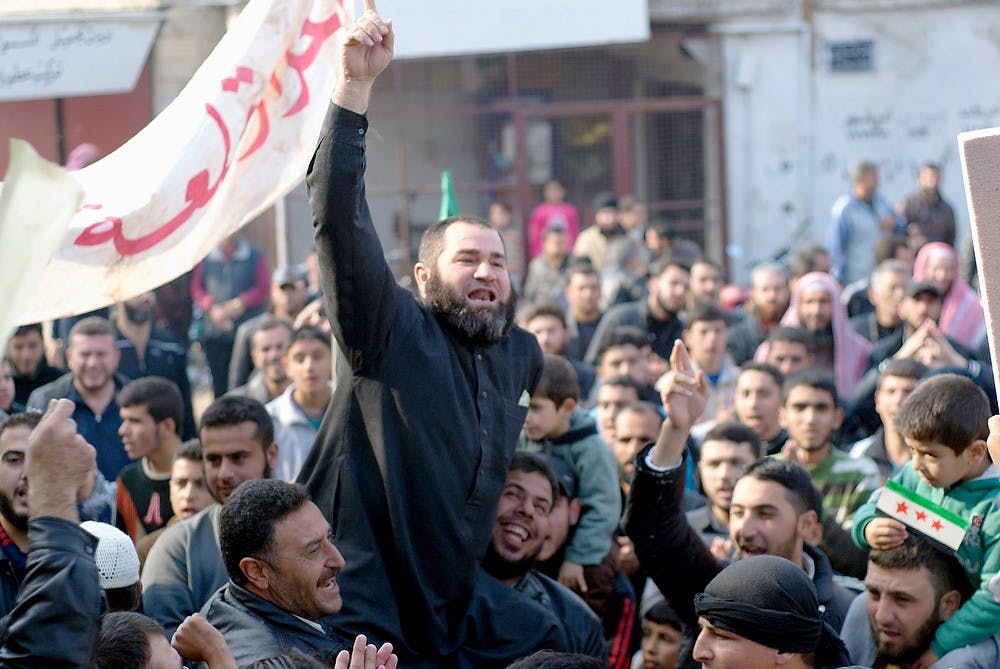 	<p>Demonstrators protest Friday in Qalat al Madiq in Syria. The conflict has hit home for some <span class="caps">MSU</span> students, who have continued to follow the violence closely. (David Enders/MCT)</p>