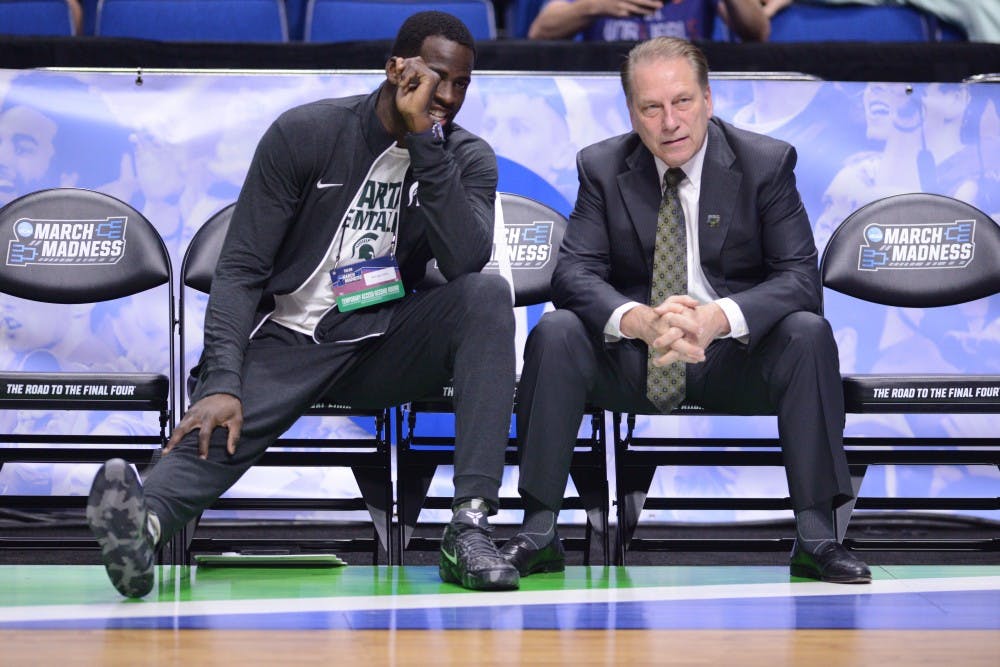 Former Spartan basketball player Draymond Green and head coach Tom Izzo speak before the game against University of Kansas in the second round of the Men's NCAA Tournament on March 19, 2017 at  at the BOK Center in Tulsa, Okla.The Spartans were defeated by the Jayhawks, 90-70.