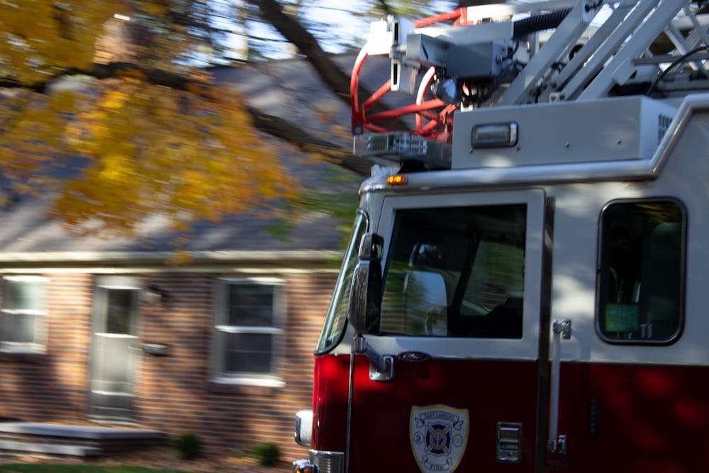 A firetruck heading through an East Lansing neighborhood Oct. 31, 2020. After Michigan State beat the University of Michigan, groups took to the streets in celebration, burning some couches on the way. 