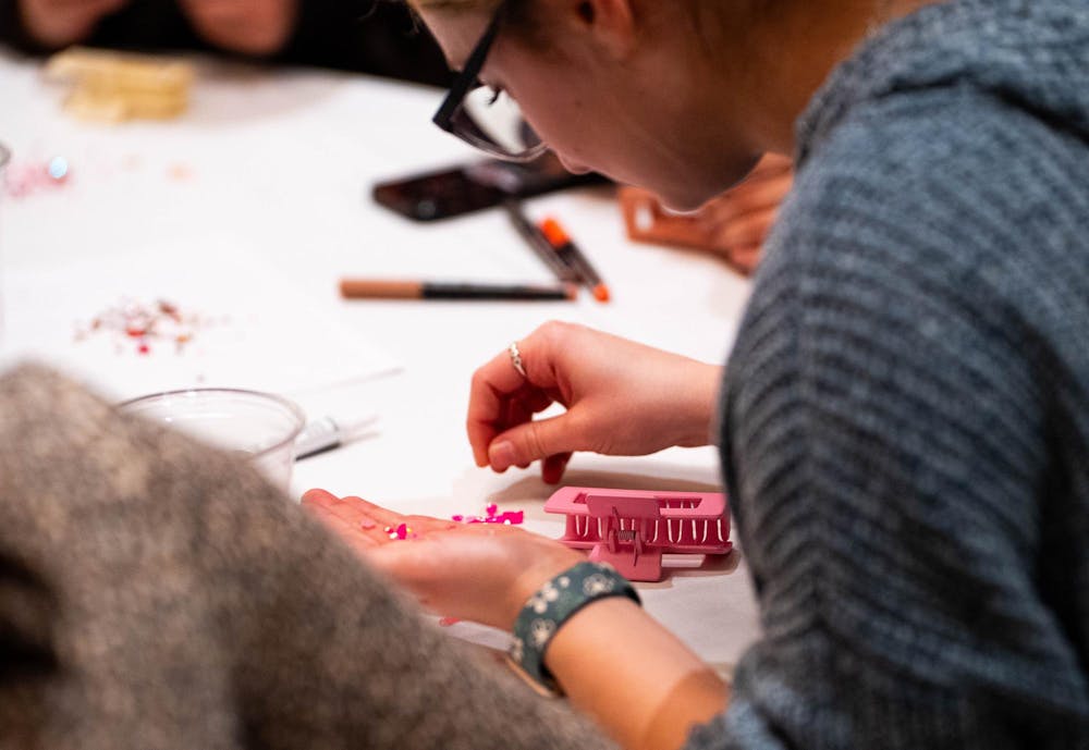 <p>Attendees decorate clamps during the UAB and CHAARG event at the MSU Union in East Lansing, Michigan on Wednesday, Jan. 14, 2026.</p>