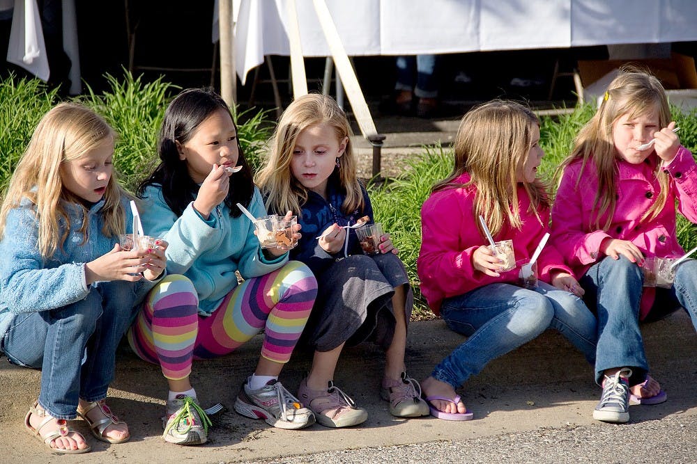 	<p>From left, Jillian Draheim, 8, Somer Soderman, 9, Abbie Draheim, 8, Kali Francisco, 9, and Nina Largey, 8 sit side by side enjoying the foods from the first-ever Taste of East Lansing event hosted by the city of East Lansing&#8217;s Community Relations Coalition April 22, 2012, at Ann Street Plaza. The event featured local food vendors, games, arts and crafts. State News File Photo</p>