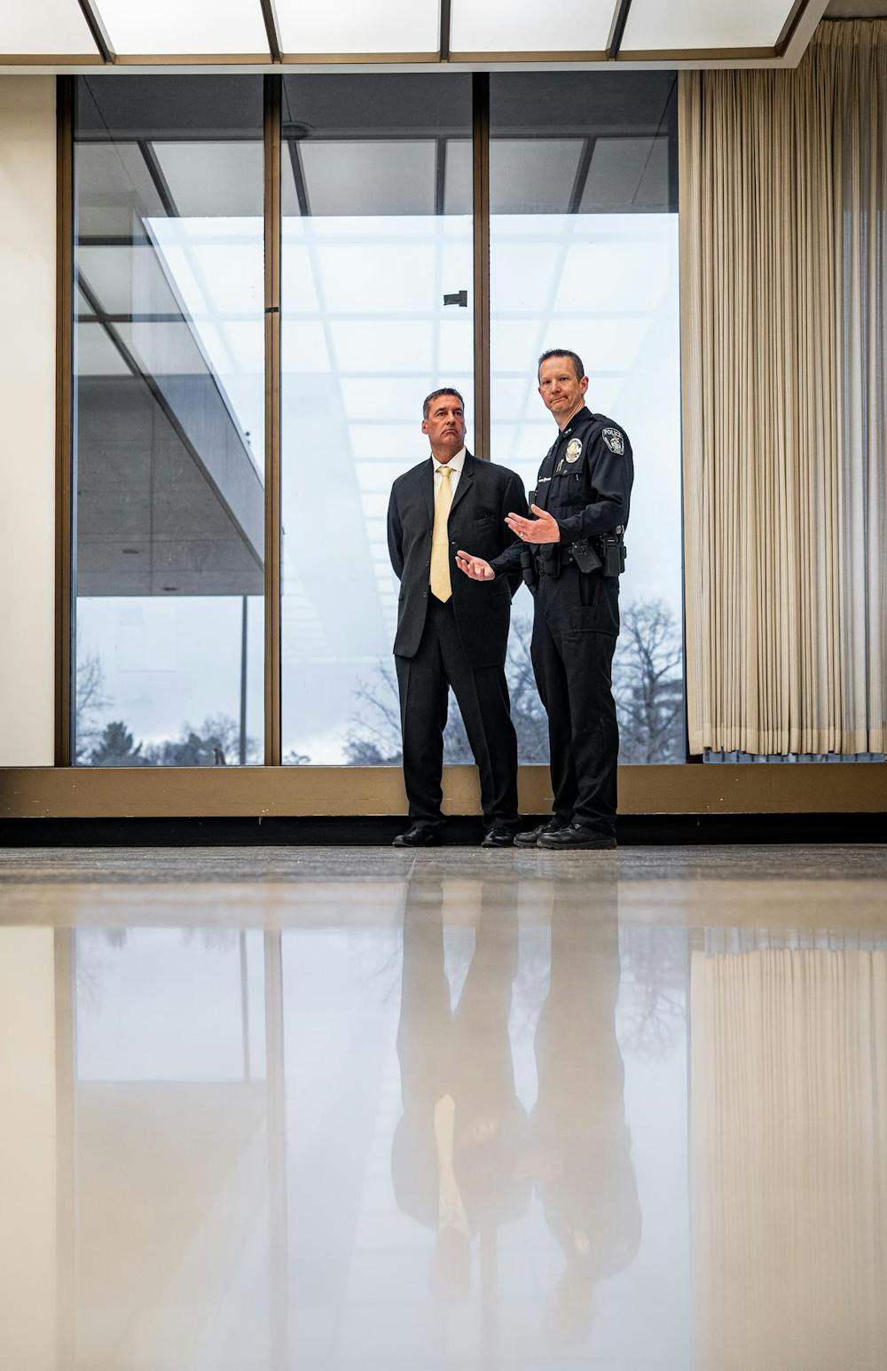 <p>Michigan State University Chief of Police Mike Yankowski and Deputy Chief Chris Rozman watch the Hurriya Coalition and MSU Sunrise protest in the lobby of the Hannah Administration Building in East Lansing, Michigan on April 11, 2025. 19 protestors were arrested after multiple warnings from the police.</p>