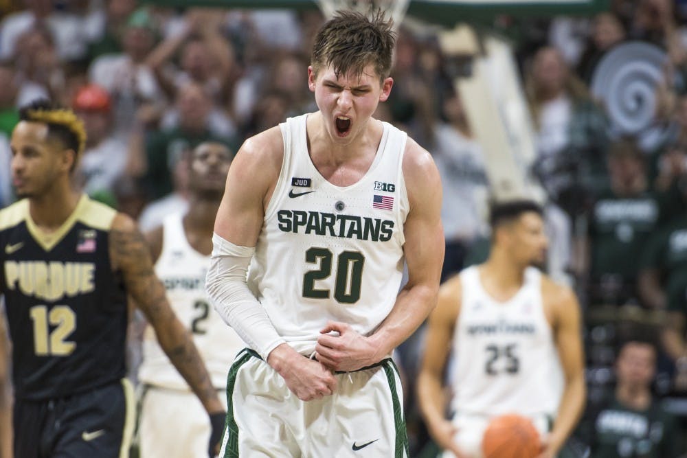 Junior guard Matt McQuaid (20) expresses emotion during the second half of the men's basketball game against Purdue on Feb. 10, 2018 at Breslin Center. The Spartans defeated the Boilermakers, 68-65. (Nic Antaya | The State News)