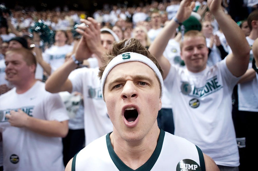 Political science and pre-law sophomore Joey Todak cheers in the Izzone before the men's basketball team's matchup with No. 4 Michigan. MSU defeated U-M, 75-52, Tuesday, Feb. 12, 2013, at Breslin Center. Justin Wan/The State News