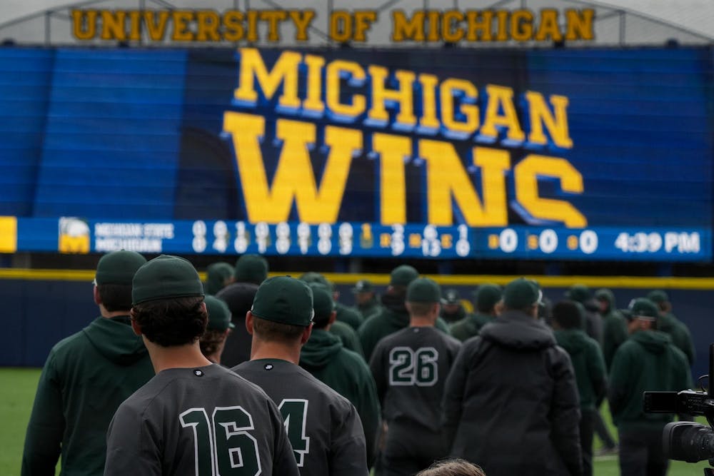 The MSU baseball team walks to the outfield of Ray Fisher Stadium after losing to the University of Michigan on April 26, 2025. The Spartans lost to the Wolverines in the second game 9-2.