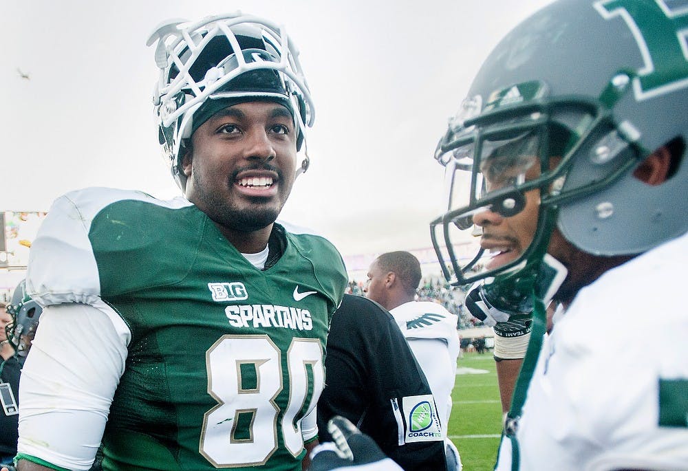 	<p>Junior tight end Dion Sims smiles after defeating Eastern Michigan, 23-7, on Saturday, Sept. 22, 2012, at Spartan Stadium. Sims had one touchdown during the game. Justin Wan/The State News</p>