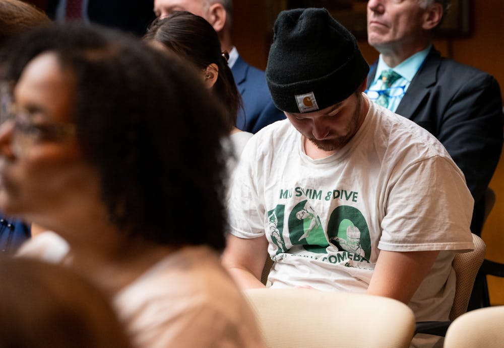An atendee of the board of trustees meeting wears an MSU Swim and Dive shirt on June 24, 2022.