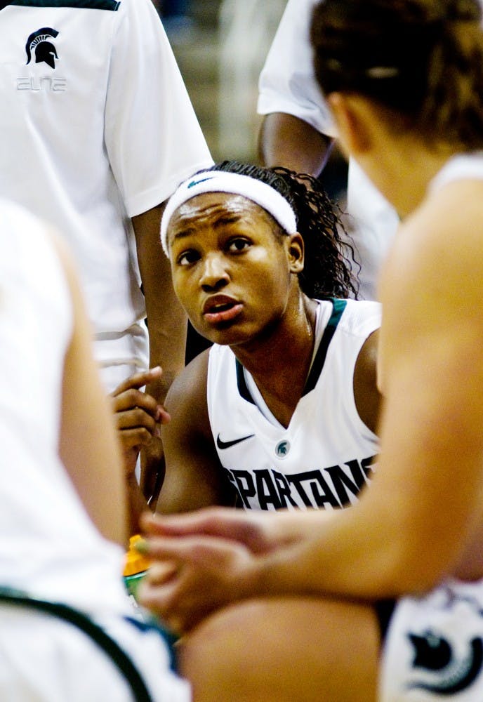 Freshman guard Kiana Johnson talks to her Michigan State teammates during a timeout Wednesday night at Breslin Center. The Spartans defeated the Wolverines 60-55. Aaron Snyder/The State News 