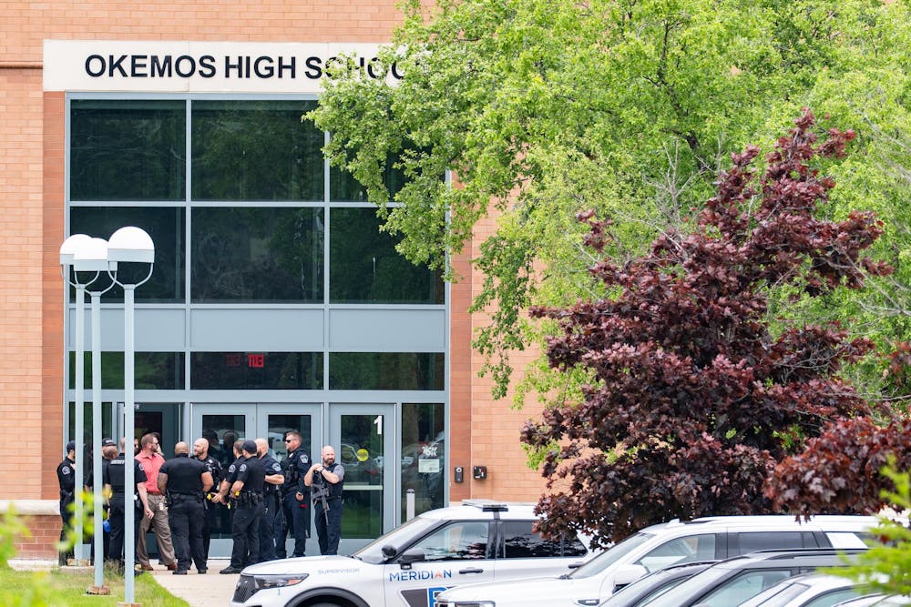 First responders and police officers gather following a "preventative lockdown" at Okemos High School in Okemos, Michigan on May 29, 2025. 