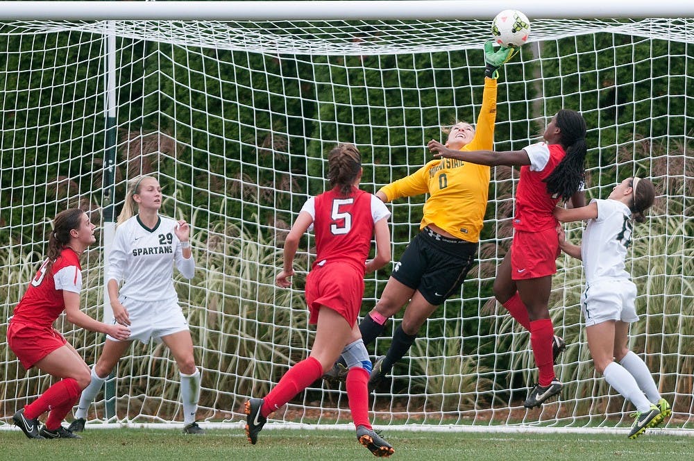 <p>Senior goalie Courtney Clem blocks a goal attempt during the game against Ohio State on Oct. 16, 2014, at the DeMartin Soccer Stadium at Old College Field. The Spartans defeated the Buckeyes, 2-1. Jessalyn Tamez/The State News </p>