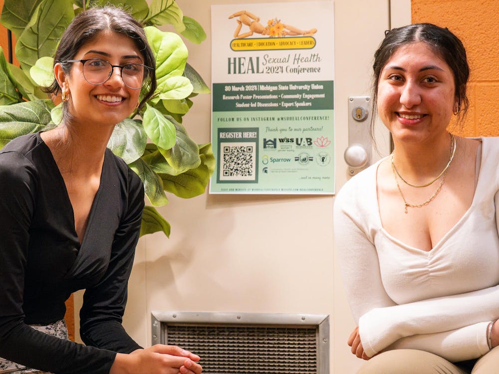 <p>Organizers Harsna Chahal (left) and Nupur Huria (right) prepare for their upcoming HEAL sexual health conference in East Lansing on March 23, 2024.</p>