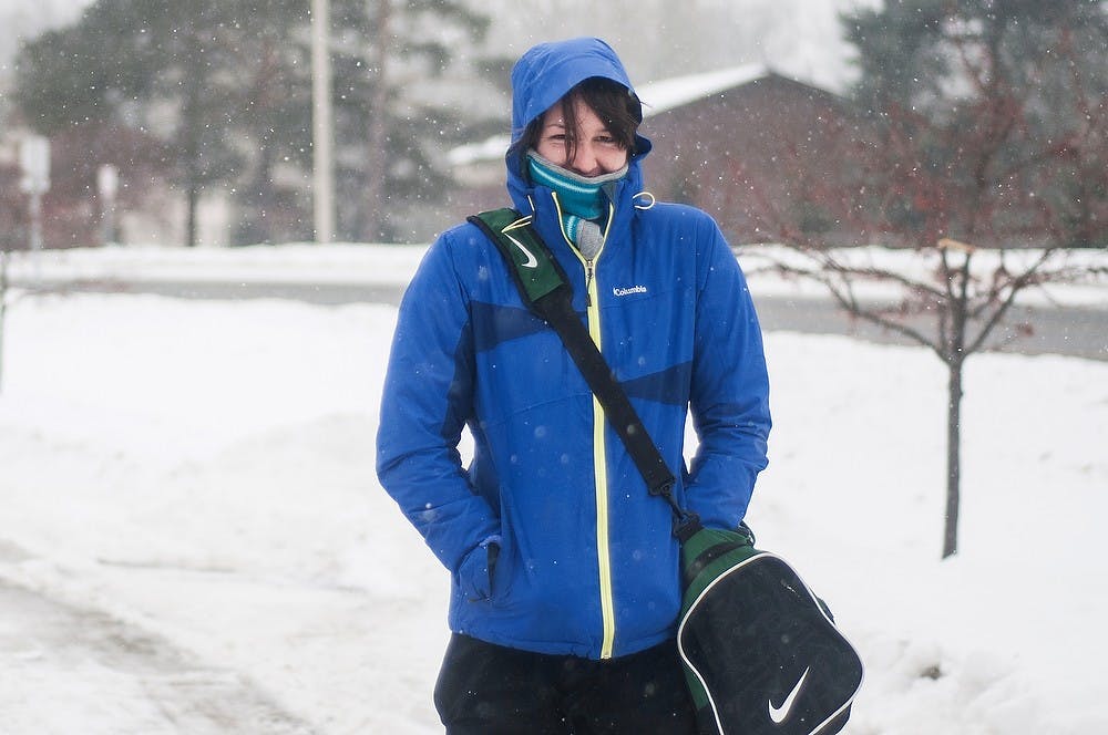 	<p>Applied engineering sophomore Lori Comer walks from her apartment Feb. 17, 2104, on Kalamazoo St. and Harrison Road. According to The Weather Channel, East Lansing can expect 3-5 inches of snow tonight and a low temperature of 20 degrees. Erin Hampton/The State News</p>