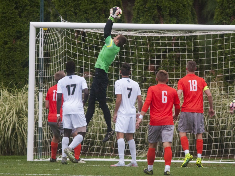 Sophomore goalie Jimmy Hague (1) jumps to catch the ball during the game against Bowling Green on Sept. 28, 2016.  The Spartans defeated the Falcons, 1-0.  