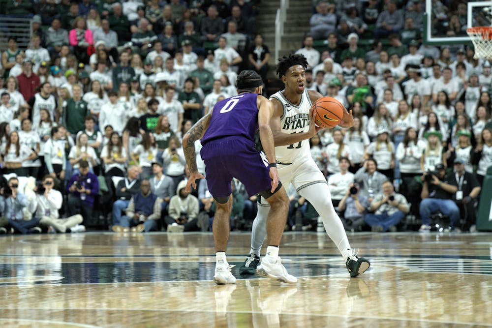 <p>Spartan guard A.J. Hoggard passes to his teammates during the match against the Northwestern Wildcats on Dec. 4, 2022. ﻿</p>
