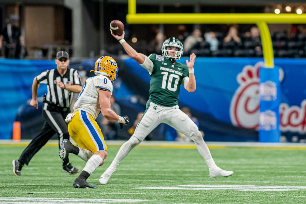 <p>Redshirt sophomore quarterback Payton Thorne gets rid of a ball, as he picks up a roughing-the-passer penalty during the Spartans&#x27; 31-21 victory against Pitt in the Chick-Fil-A Peach Bowl on Dec. 30, 2021.</p>