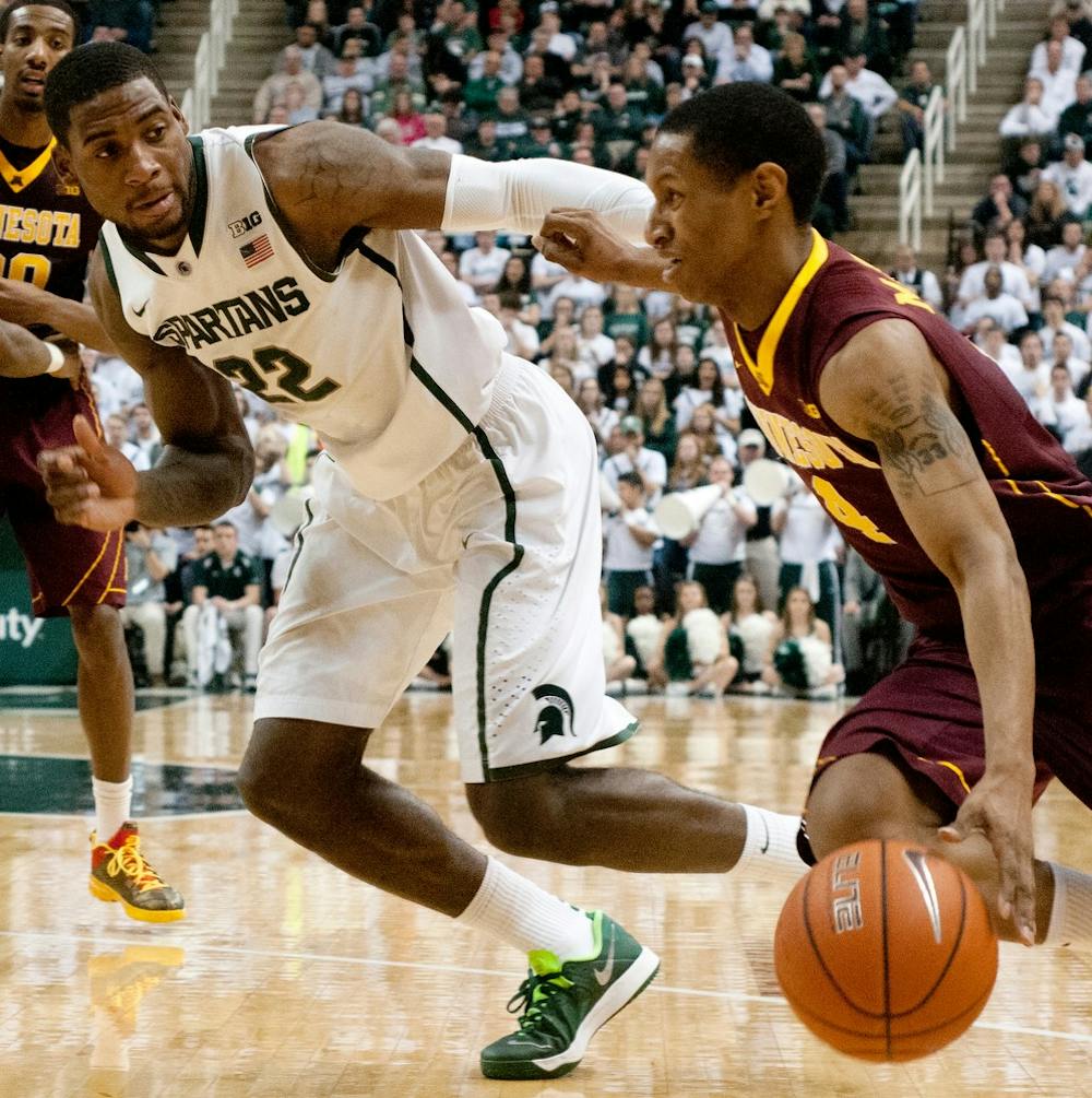 	<p>Junior guard/forward Branden Dawson guards Minnesota guard DeAndre Mathieu on Jan. 11, 2014, at the Breslin Center. <span class="caps">MSU</span> beat Minnesota in overtime, 87-75. Betsy Agosta/The State News</p>