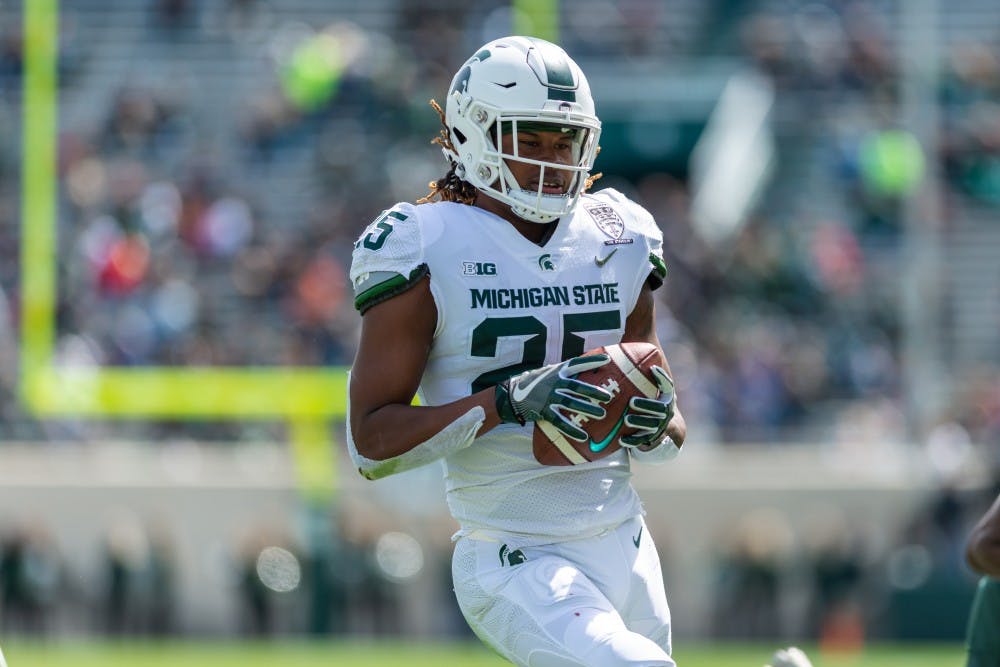 <p>Senior wide receiver Darrell Stewart Jr. runs into the end zone for a touchdown. The green team beat the white team, 42-26, in the MSU spring football game at Spartan Stadium on April 13, 2019. </p>