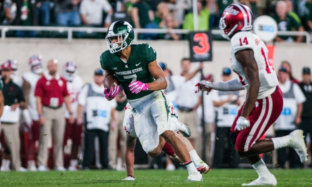 Freshman wide receiver Cody White (7) runs upfield late in  the game against Indiana on Oct. 21, 2017, at Spartan Stadium. The Spartans defeated the Hoosiers, 17-9.