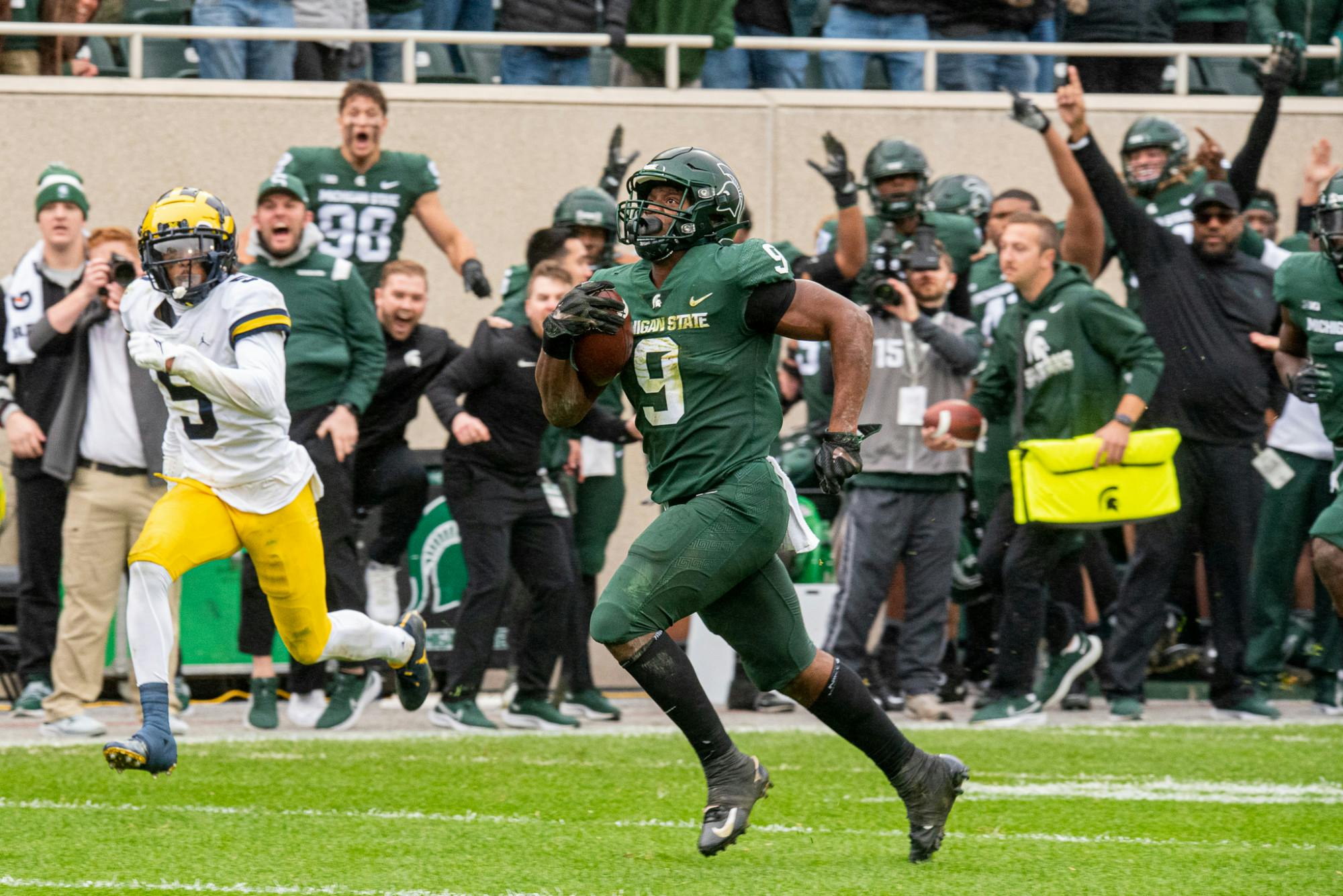 <p>Junior running back Kenneth Walker III breaks away for a touchdown during the Spartans&#x27; 37-33 win against the Wolverines on Oct. 30, 2021.</p>