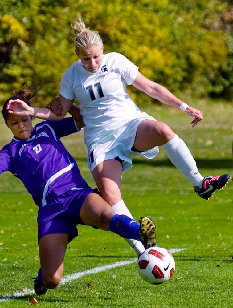 	<p>Then-junior forward Laura Heyboer fights for possession of the ball with Northwestern defenseman Ally Arca on Oct. 17 of last year. In a 3-2 loss Friday, Heyboer became the Spartans&#8217; all-time leading scorer with her goal in the second half.</p>