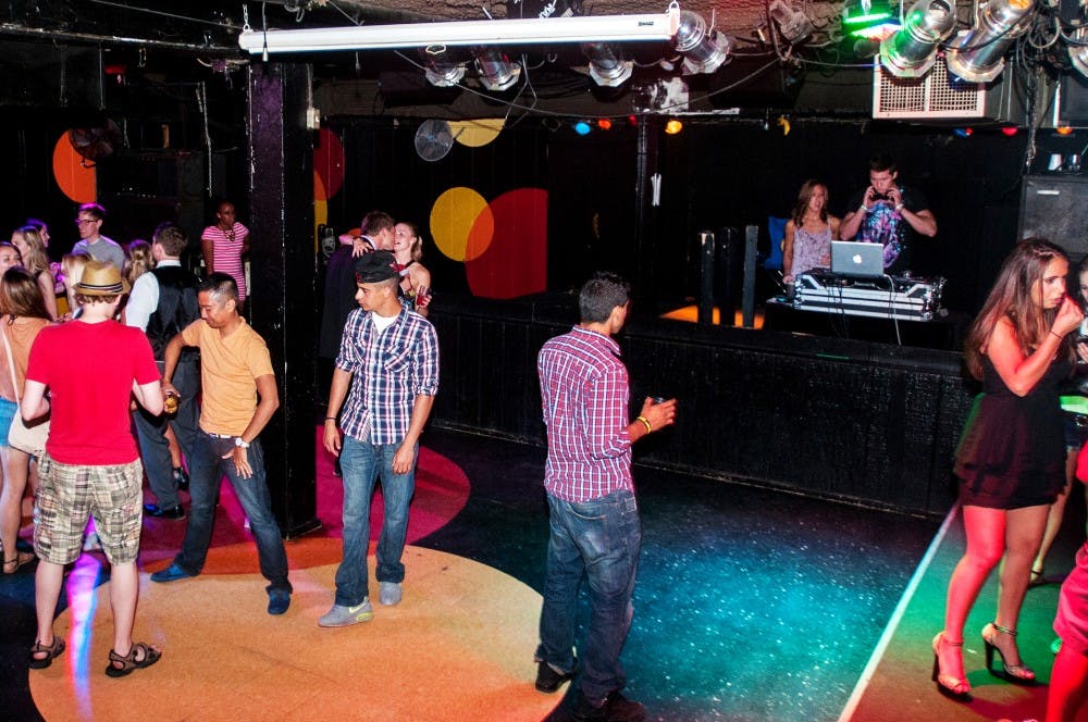 Senior human biology major Lucas Zavadil, stage name DJ Liability entertains the crowd Saturday night, June 17, 2012 at Rick's American Cafe.  Rick's has been hosting live musical acts since 1980. Adam Toolin/The State News