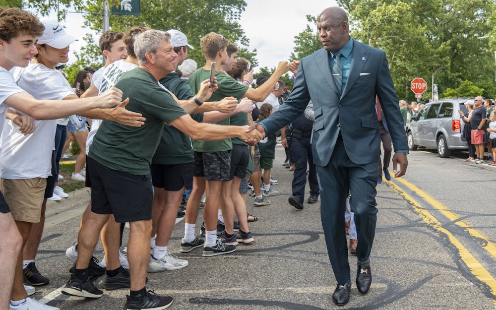 Head coach Mel Tucker is greeted by fans ahead of Michigan State’s home opener against Western Michigan at Spartan Stadium on Sept. 2, 2022. 