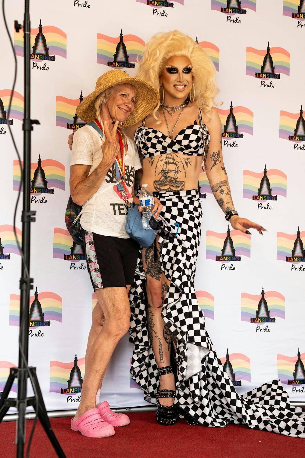 A Lansing Pride attendee poses for a photo with Loosey LaDuca at Lansing Pride, June 22, 2024. The Lansing Pride festival was held in Lansing's Old Town neighborhood and attracted people from across the state. 