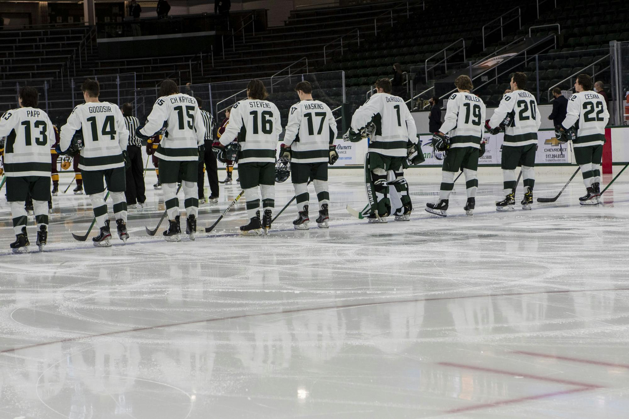 <p>Michigan State hockey lines up before the national anthem in anticipation of their game against Minnesota. The Spartans fell to the Golden Gophers, 3-1, on Dec. 3, 2020.</p>