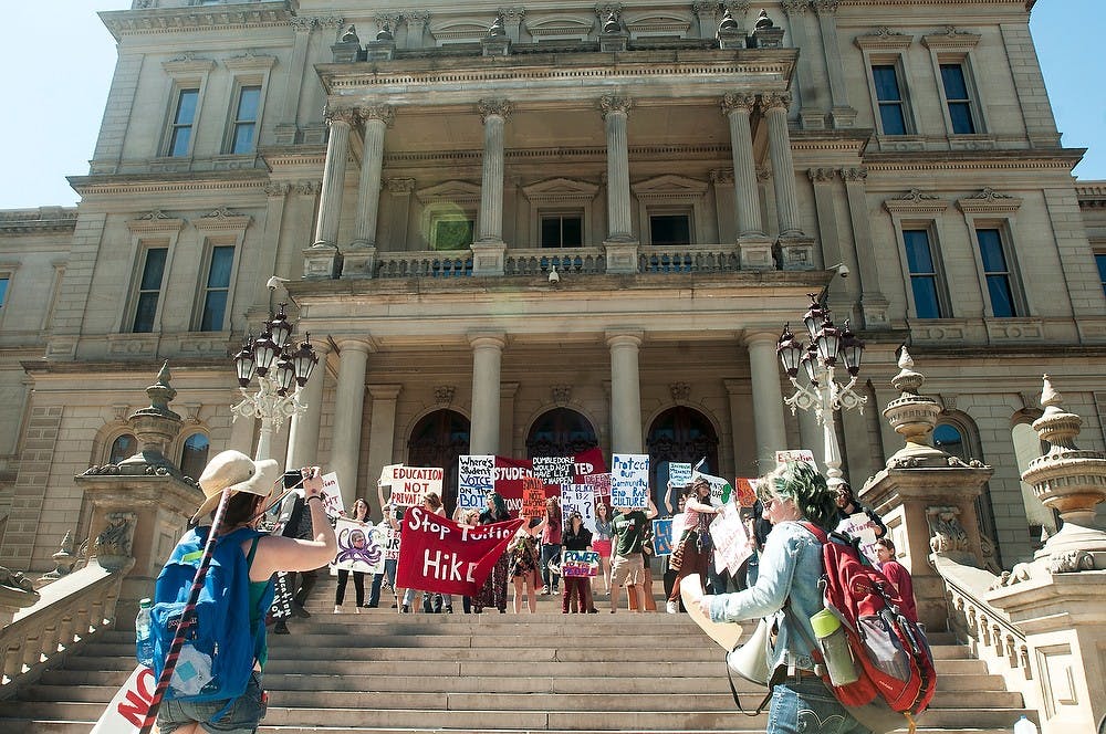 <p>Students arrive at the state Capitol during a protest against tuition hikes hosted by MSU Students United on April 11, 2014, in Lansing. Students marched through campus, beginning the march at Beaumont Tower. Danyelle Morrow/The State News</p>