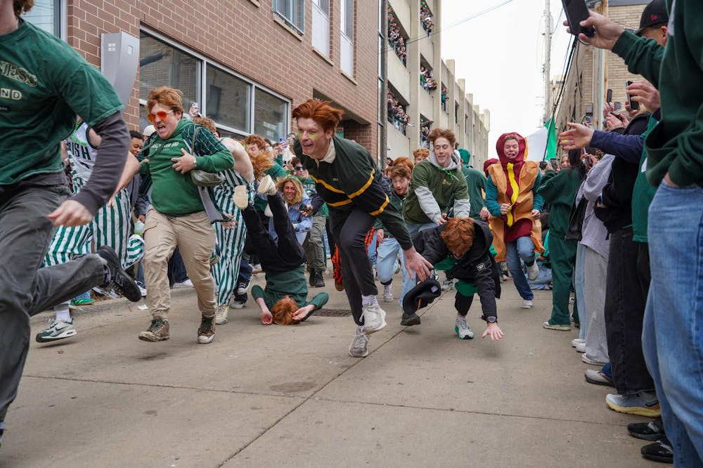 Michigan State University students participate in downtown East Lansing, Mich., for the Ginger Run on Saturday, March 14, 2026.