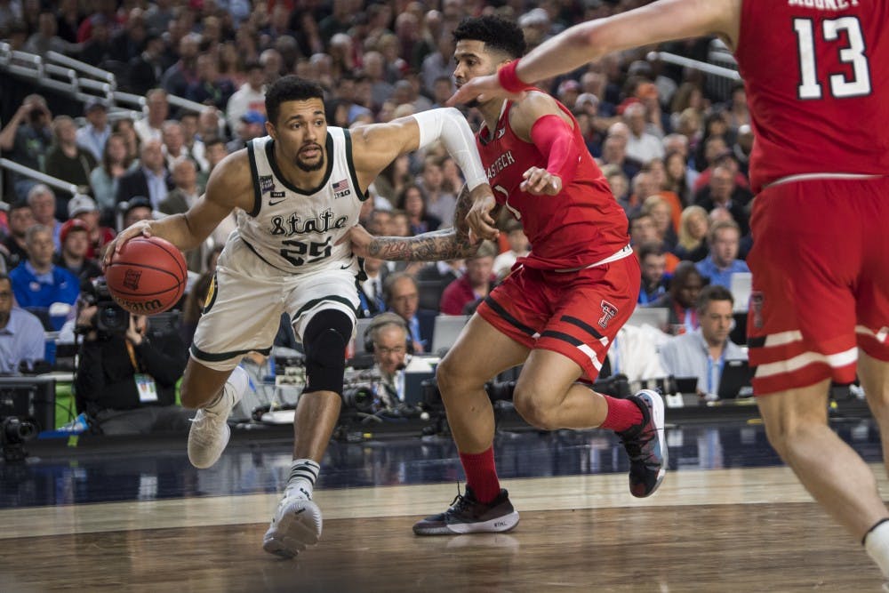 Senior forward Kenny Goins (25) drives to the basket during the second half of the NCAA Final Four game against Texas Tech at U.S. Bank Stadium in Minneapolis on April 6, 2019. The Spartans lost to the Red Raiders 61-51.  (Nic Antaya/The State News)