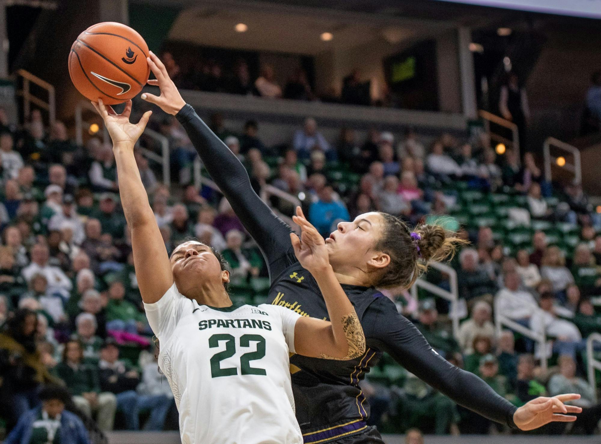 <p>Freshman forward Taiyier Parks (14) shoots from underneath the basket during the game against Northwestern Jan. 23, 2020 at the Breslin Center. The Spartans fell to the Wildcats, 76-48.</p>