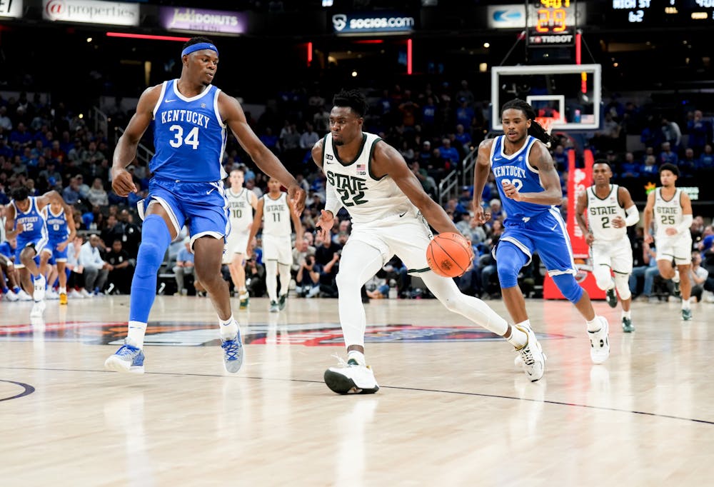 <p>Junior center Mady Sissoko makes his way down the court during a game against Kentucky at the Champions Classic in Indianapolis at Gainbridge Fieldhouse on Nov. 15, 2022. The Spartans came away with the win with a score of 86-77. </p>