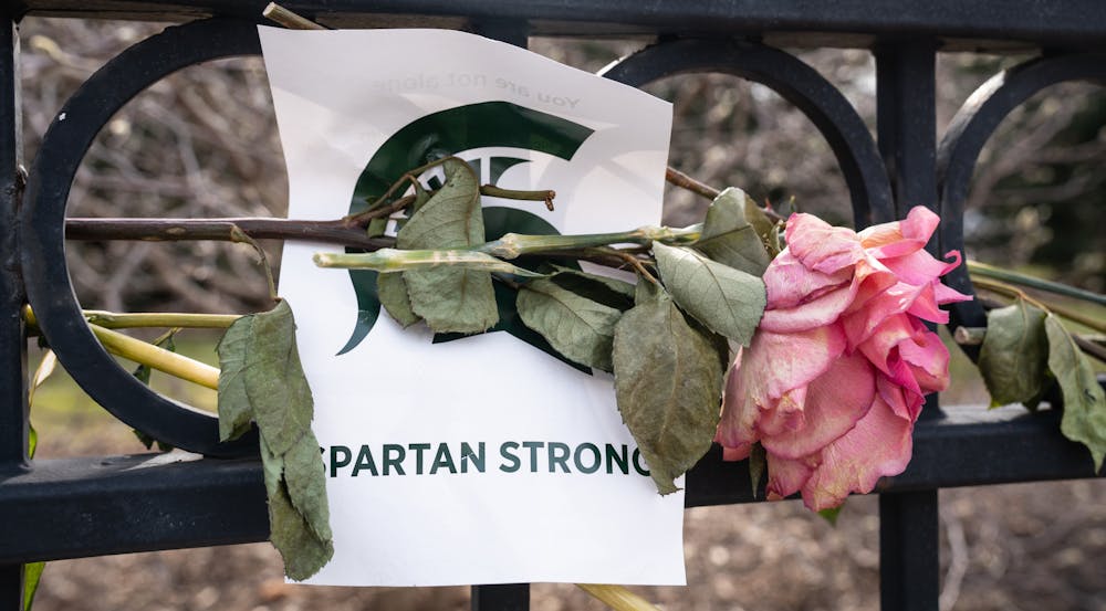 A vigil sits outside the fence of the Union on Feb. 20, 2023. The day before, 'Spartan Sunday' was held on campus where students and the community came together to take back the campus after a mass shooting took place on Feb. 13, 2023.
