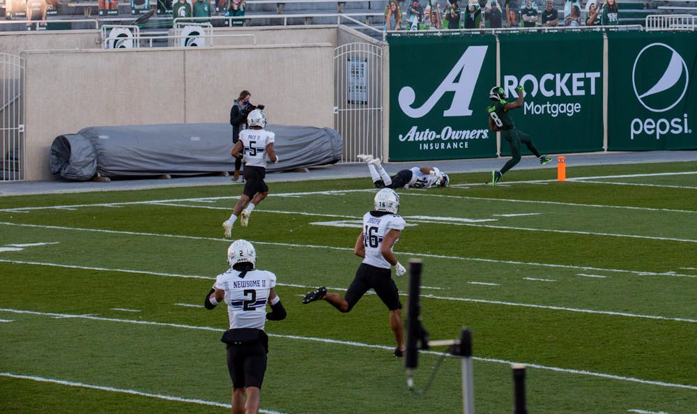 <p>Michigan State&#x27;s No.8, Jalen Nailor hopping into the endzone as he scores the first touchdown of the game against NorthWestern on Saturday, November 28, 2020. </p>