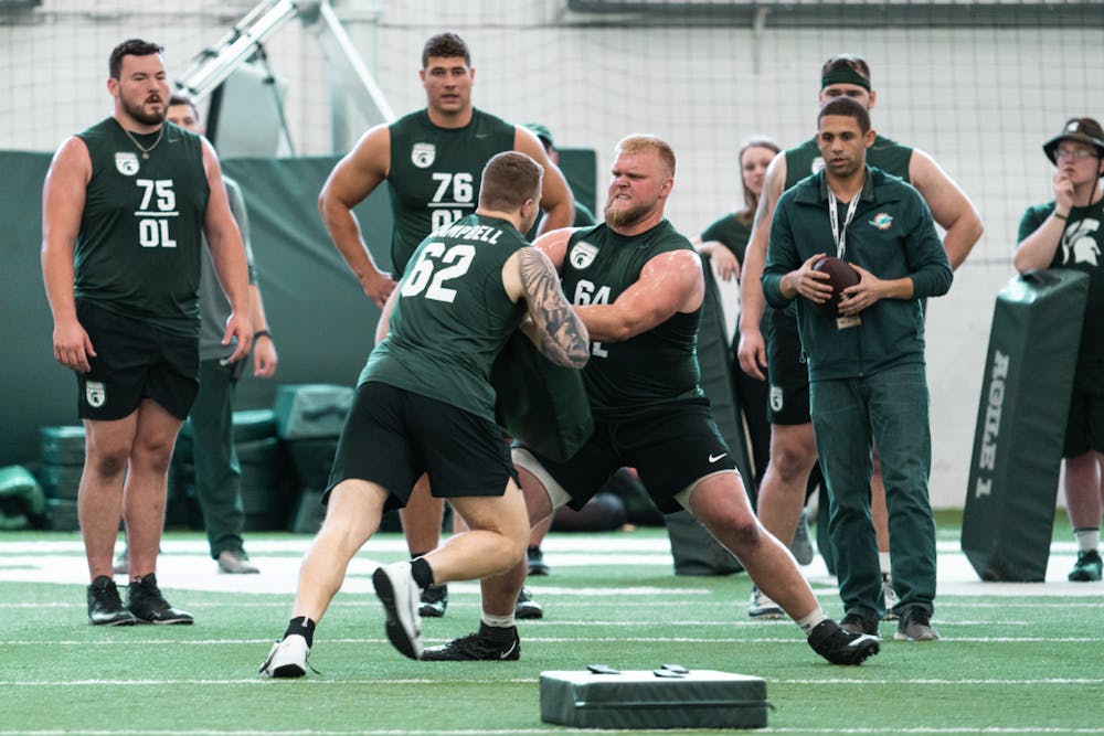 <p>Michigan State graduate students Luke Campbell and Matt Allen going head to head during Pro Day on-field position drills, on Mar. 16, 2022 at the Duffy Daugherty Indoor Football Building.</p>