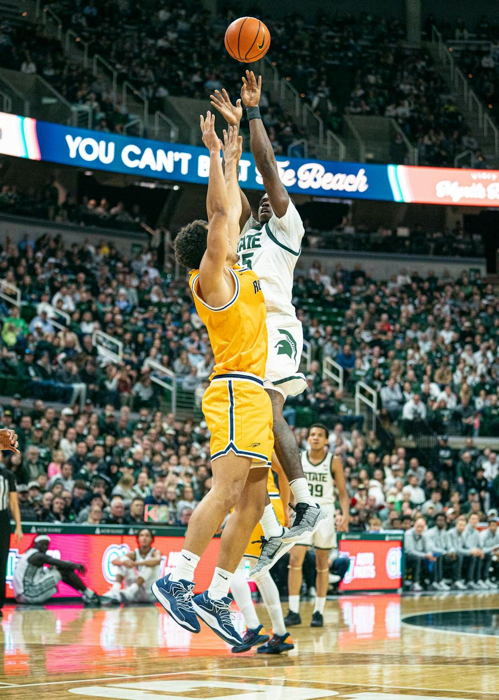 <p>MSU junior forward, Coen Carr (55) leaps high in the air to make a shot while a Toledo player tries to block the shot during the MSU versus Toledo men's basketball game at the Breslin Center in East Lansing, Michigan on Tuesday, Dec. 16, 2025.</p>