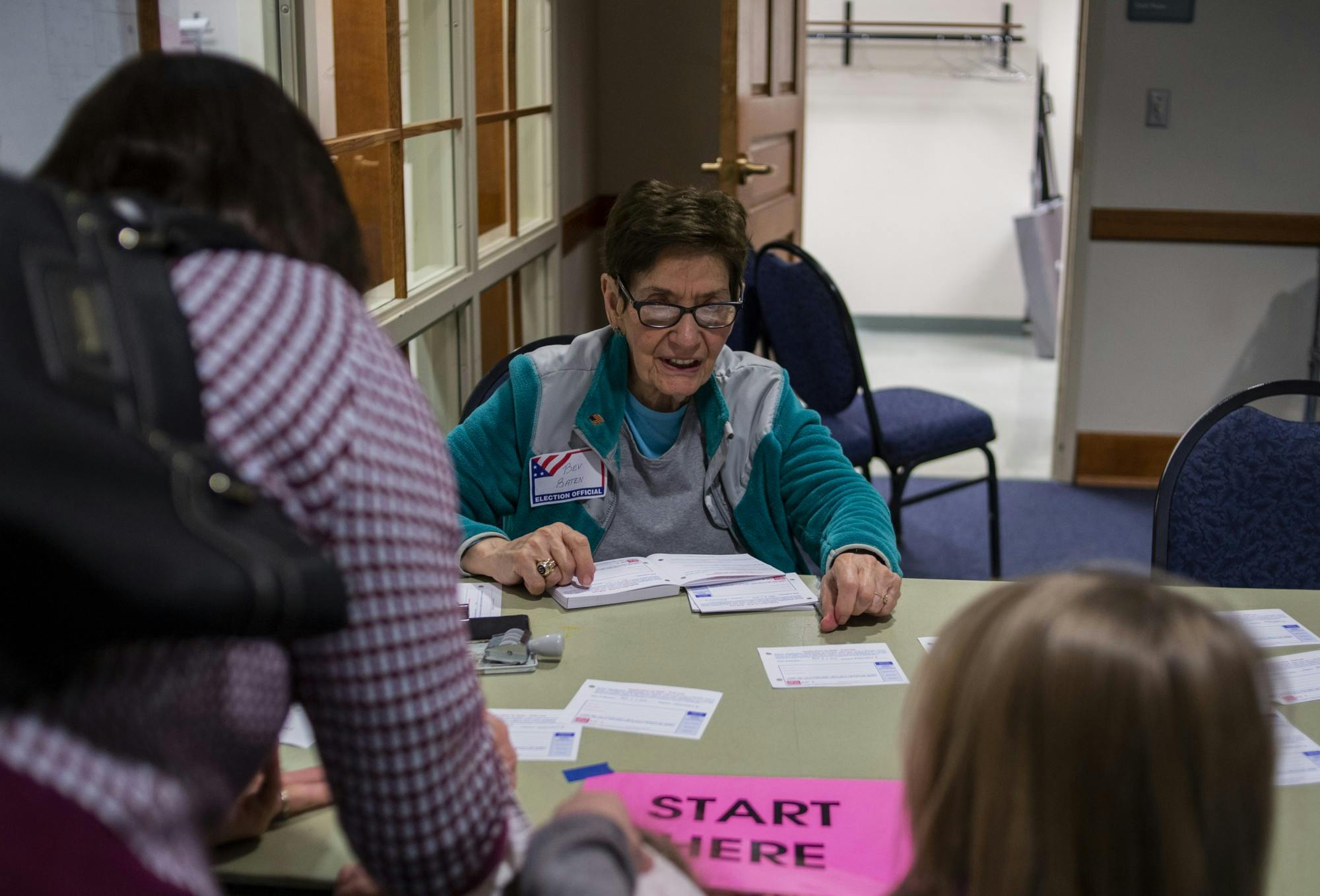 East Lansing resident and volunteer Bev Baten helps people vote in the East Lansing City Council Election at Hannah Community Center on Nov. 5, 2019. 