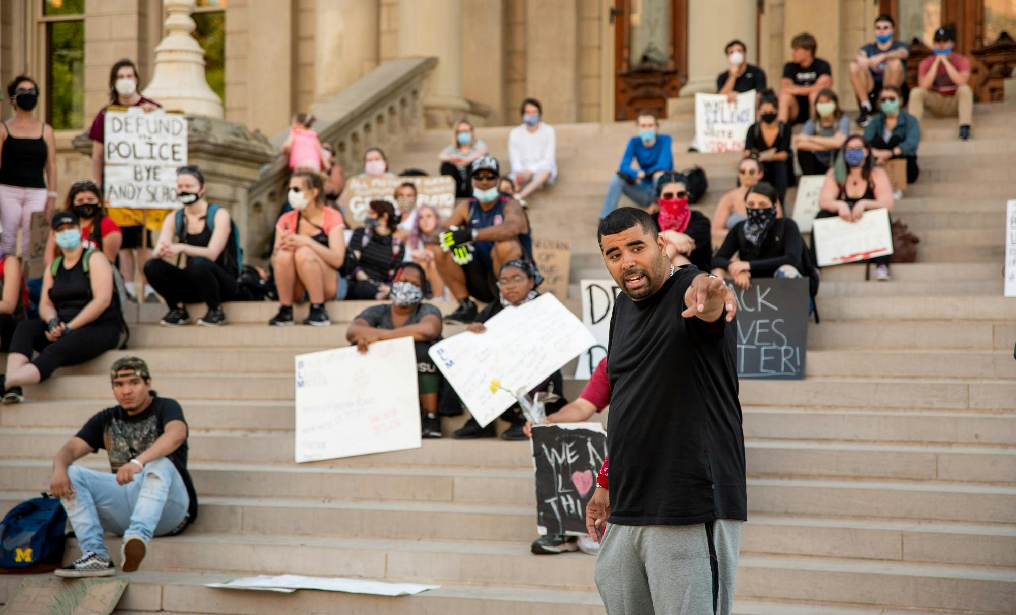 <p>Paul Birdsong speaks to a group of protesters before the group marches two miles from the Capitol to Lansing Mayor Andy Schor&#x27;s house with a list of demands for him June 6, 2020.</p>