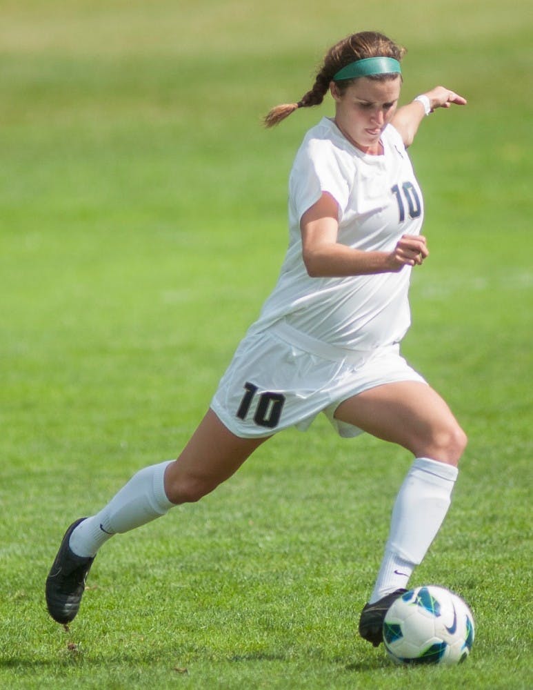 Junior defender Annie Steinlage clears the ball on Sunday, Sept. 9, 2012 at DeMartin Stadium. Defenders like Annie were key in the Spartans victory on Sunday. James Ristau/The State News