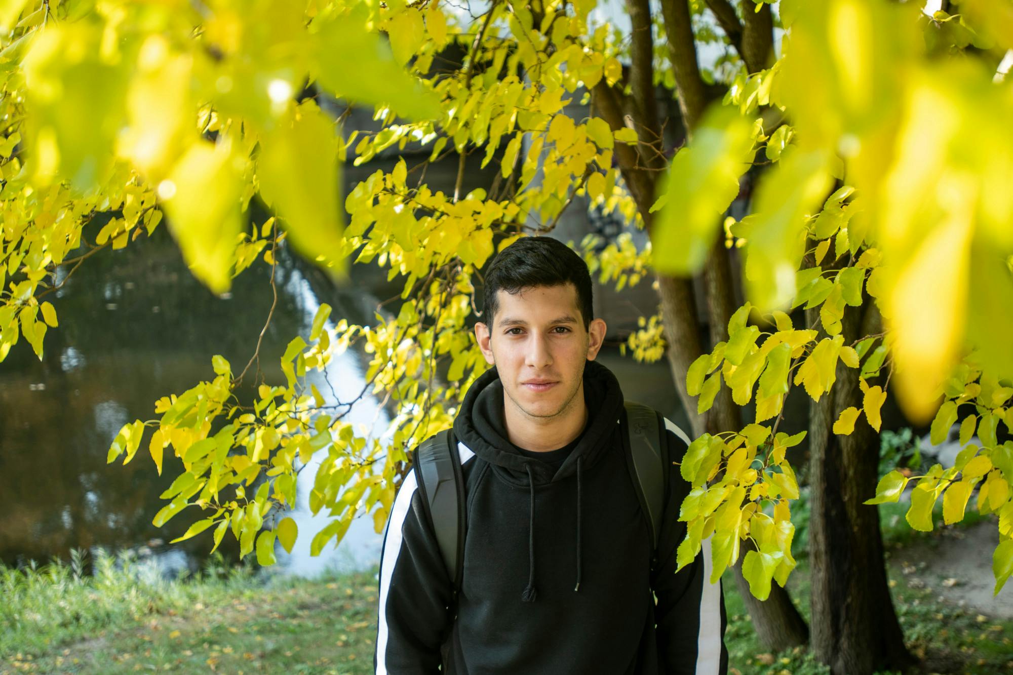 <p>Civil engineering junior Francisco Campos Iannacone poses for a portrait near the Red Cedar River on Oct. 9, 2020.</p>