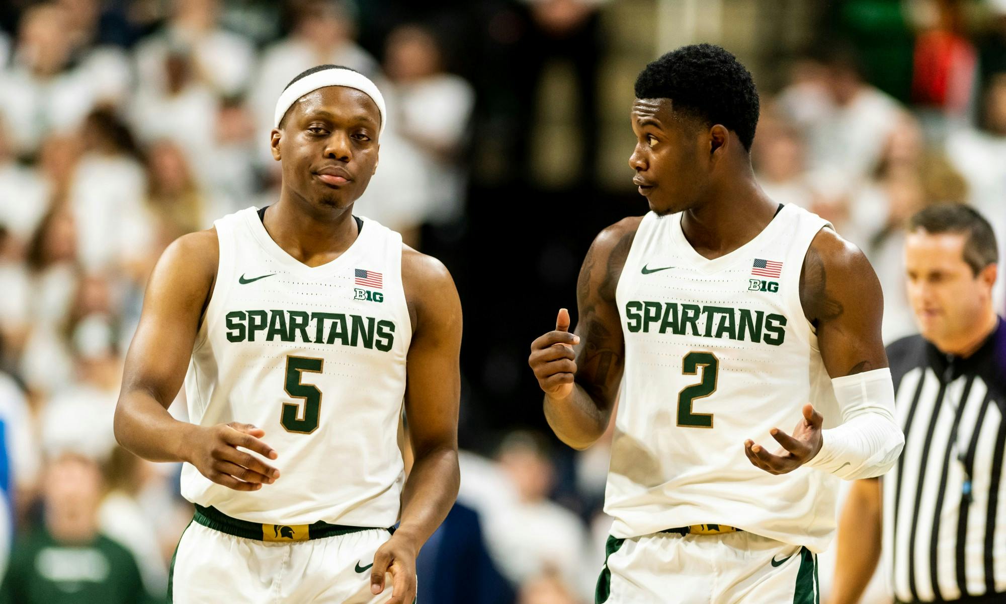 Freshman guard Rocket Watts (2) talks to senior guard Cassius Winston (5) after a timeout.The Spartans defeated the Britons, 85-50, at the Breslin Student Events Center on October 29, 2019. 