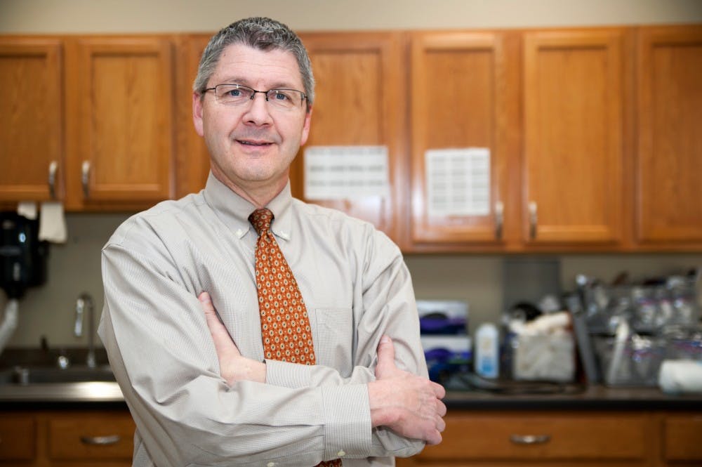 Dr. Doug Dietzel poses for a portrait on Jan. 25, 2016 at the MSU Sports Medicine office at 4660 South Hagadorn.