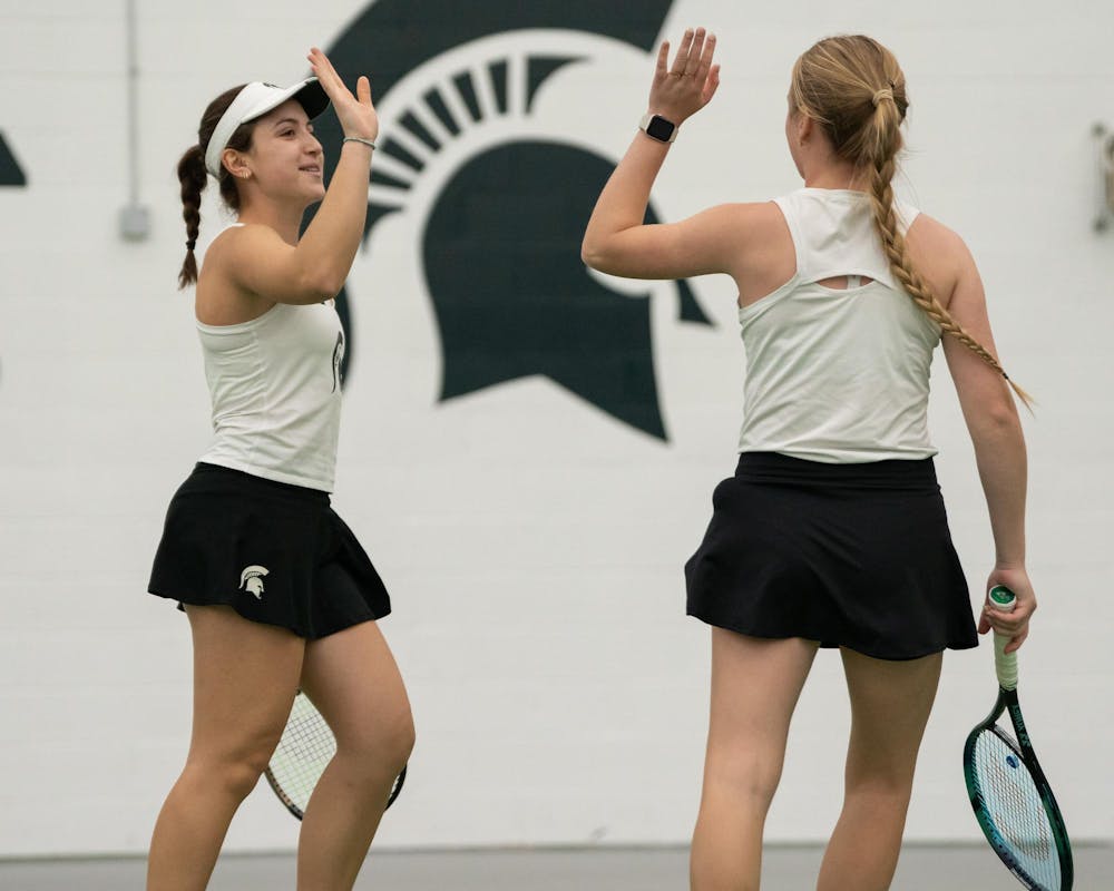 <p>MSU junior Matilde Morais and redshirt sophomore Hanna Tsitavets celebrate after a rally against Xavier in their doubles match at the MSU Indoor Tennis Center on Jan. 24, 2025. They would go on to win their match six to four.</p>