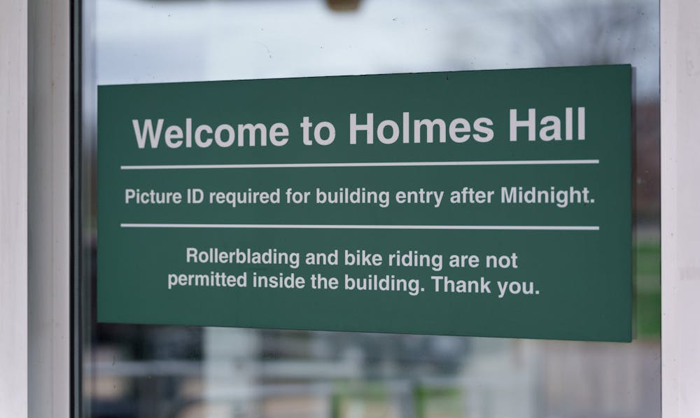 Welcome to Holmes Hall sign right outside of Holmes Hall, on May 4, 2022.
