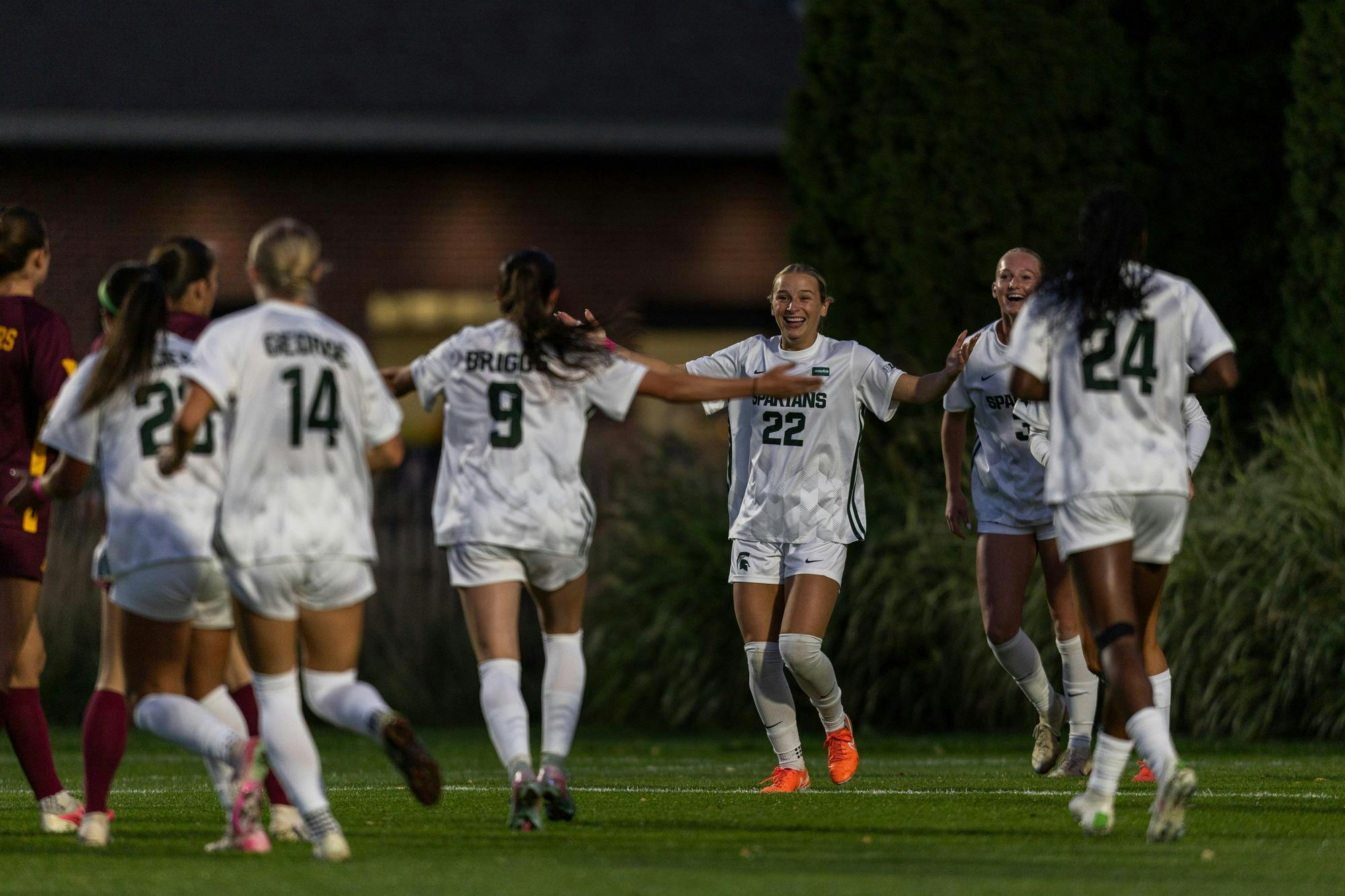 <p>Michigan State senior midfielders Kayla Briggs (9) and Ella Janz (22) celebrate after scoring a goal during the soccer game against Minnesota at DeMartin Stadium in East Lansing, Mich., on Thursday, Oct. 8, 2026.</p>