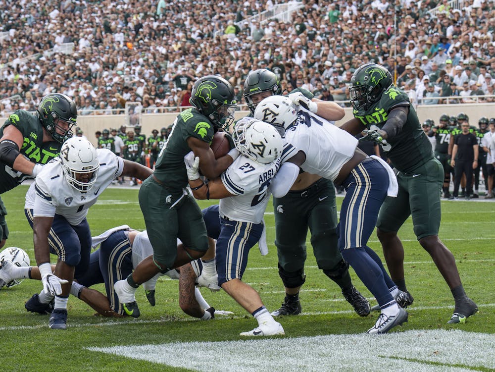 Fifth-year running back Jarek Broussard, 3, pushes through the Akron defense for a Spartan touchdown during Michigan State’s game against the Zips on Sat., Sept. 10, 2022 at Spartan Stadium.