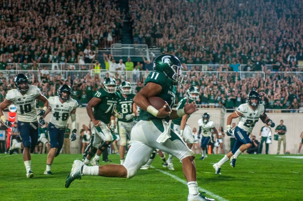<p>Sophomore running back Connor Heyward (11) runs down the field during the game against Utah State on Aug. 31, 2018 at Spartan Stadium. The Spartans defeated the Aggies; 38-31.</p>