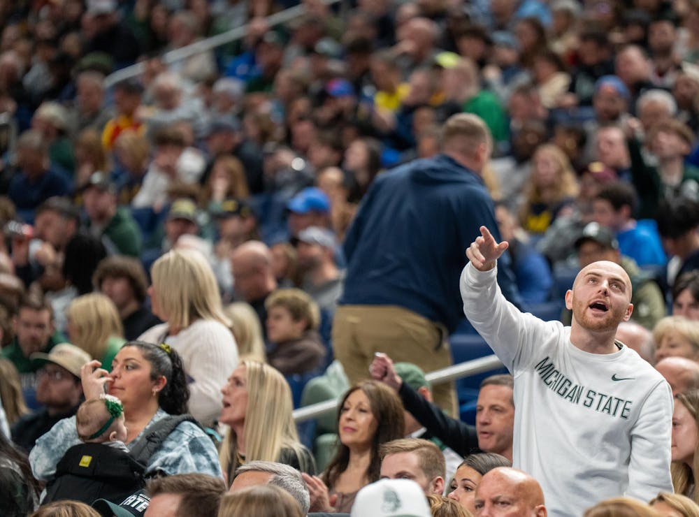 An MSU fan cheers in the crowd during the March Madness matchup against University of Louisville at the KeyBank Center in Buffalo, New York on March 21, 2026.
