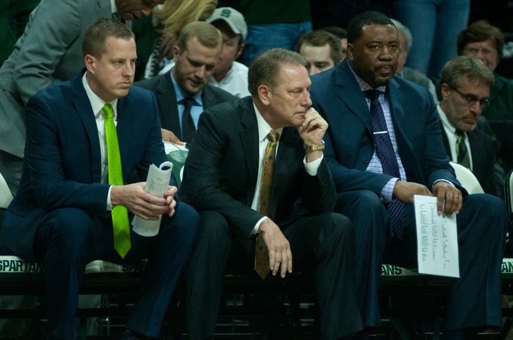 From left to right, assistant coach Dane Fife, head coach Tom Izzo and associate head coach Dwayne Stephens watch the team during the game against Iowa on Jan. 14, 2016 at Breslin Center. The Spartans the were defeated by the Hawks, 76-59.